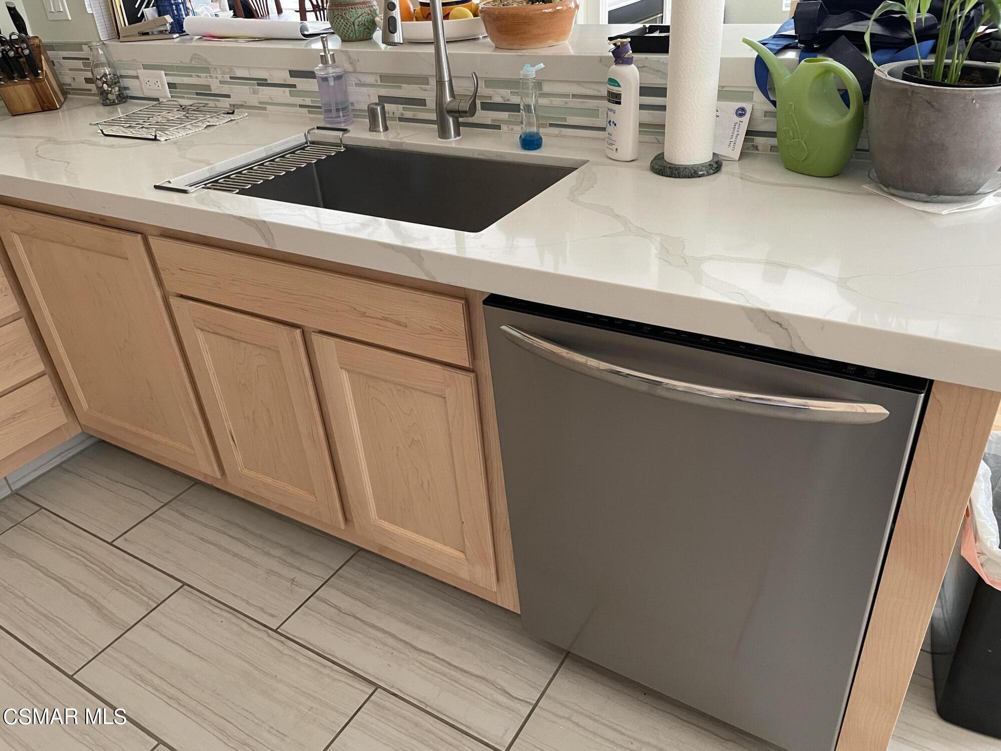 28587 Haskell Canyon Road Saugus, CA 91390 - Photo 7 of 26 a view of a sink and dishwasher