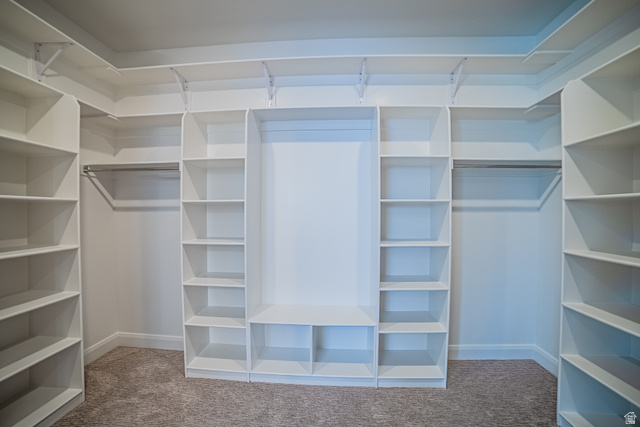 223 South Cottonwood Road, Unit 7501 Vineyard, UT 84059 - Photo 29 of 45 Custom closet system featuring extensive shelving, hanging rods, and built-in compartments