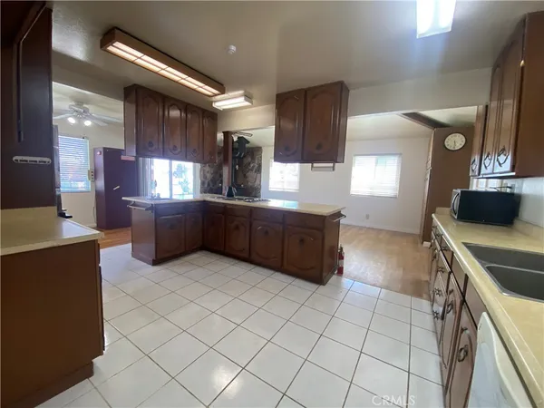 a kitchen with stainless steel appliances a sink and a stove top oven