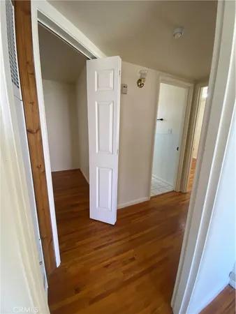 a view of front door with wooden floor