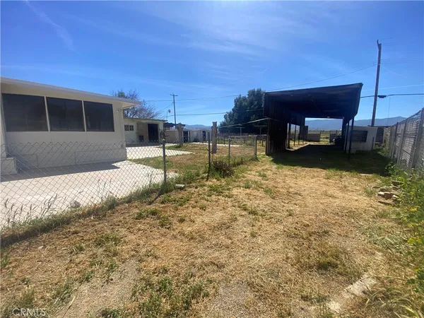 a backyard of a house with yard and garage