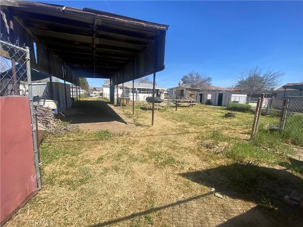 a view of a backyard of the house