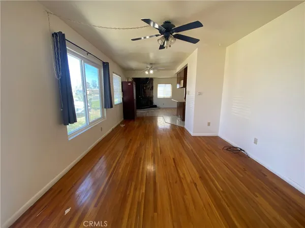 a view of a house with wooden floor and windows