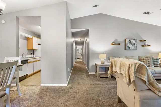 a living room with furniture and a table