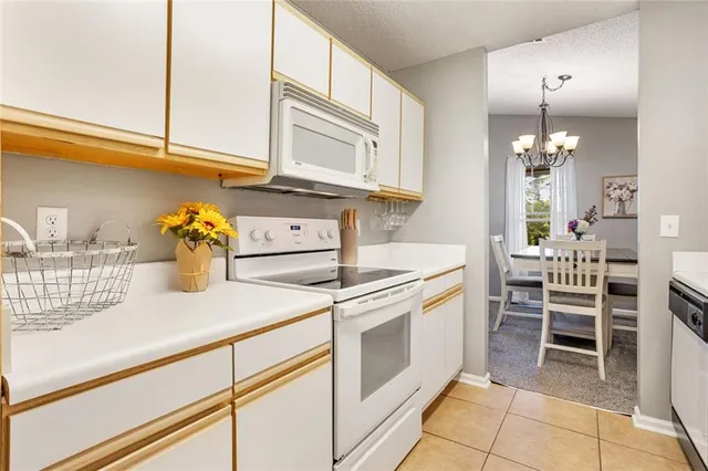 a kitchen with a stove and cabinets