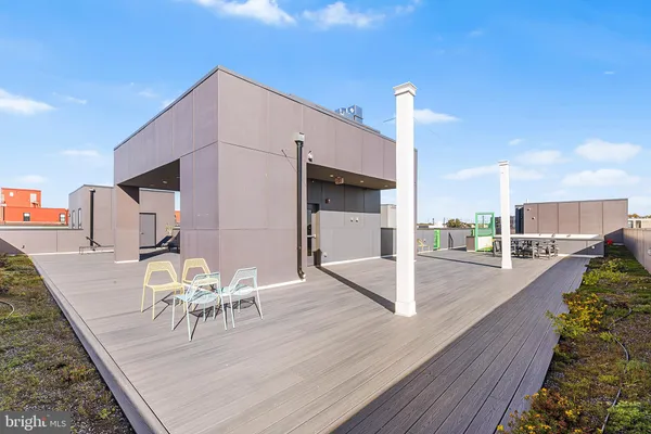 a view of living room kitchen and patio