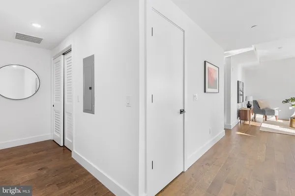 a view of a room with wooden floor sink and bathroom
