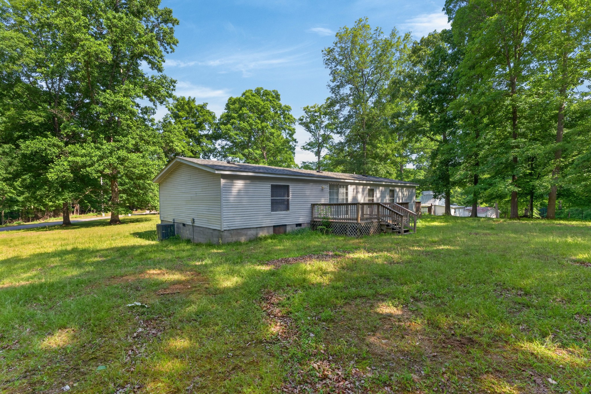 228 Shasteen Ridge Road Lynchburg, TN 37352 - Photo 40 of 53 a view of an house with backyard space and garden