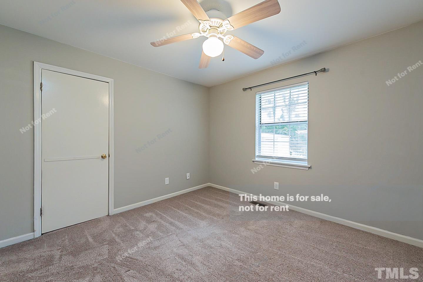 917 Horton Road Durham, NC 27704 - Photo 13 of 17 wooden floor in an empty room with a window