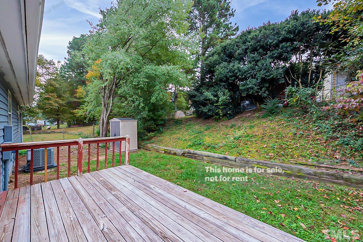 917 Horton Road Durham, NC 27704 - Photo 17 of 17 a view of backyard with a deck and wooden floor
