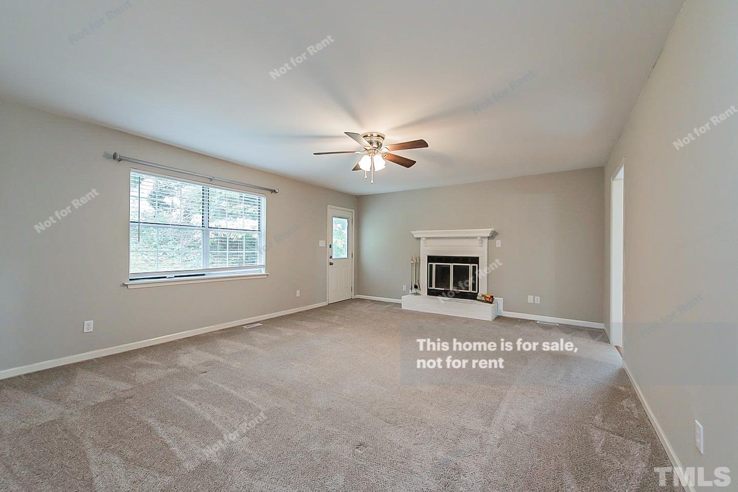 917 Horton Road Durham, NC 27704 - Photo 3 of 17 a view of an empty room with a window
