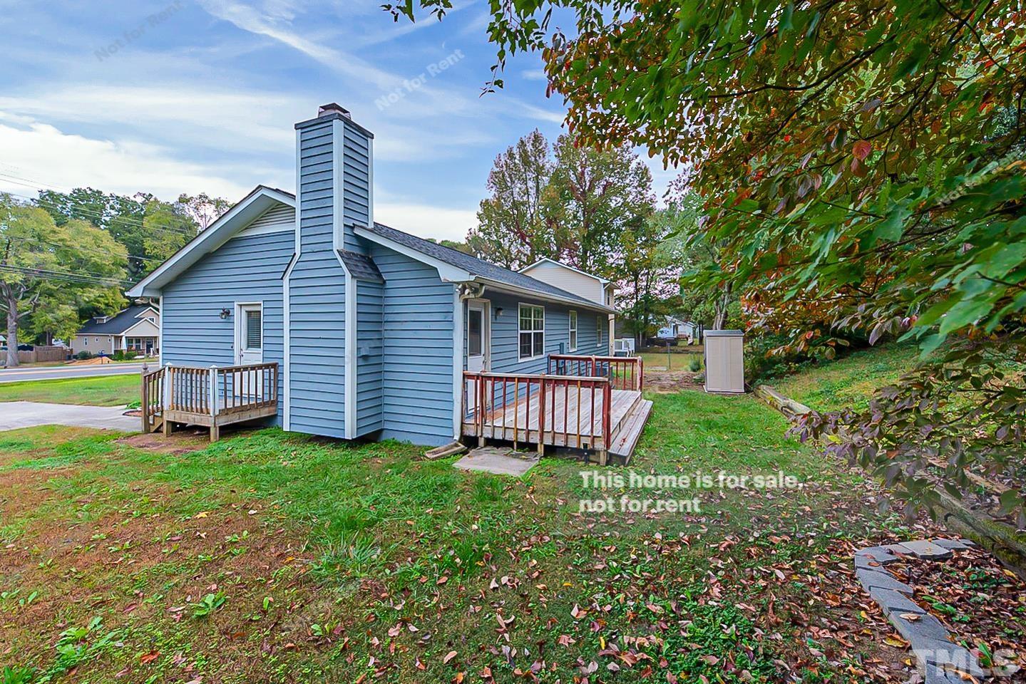 917 Horton Road Durham, NC 27704 - Photo 5 of 17 a backyard of a house with garden and deck