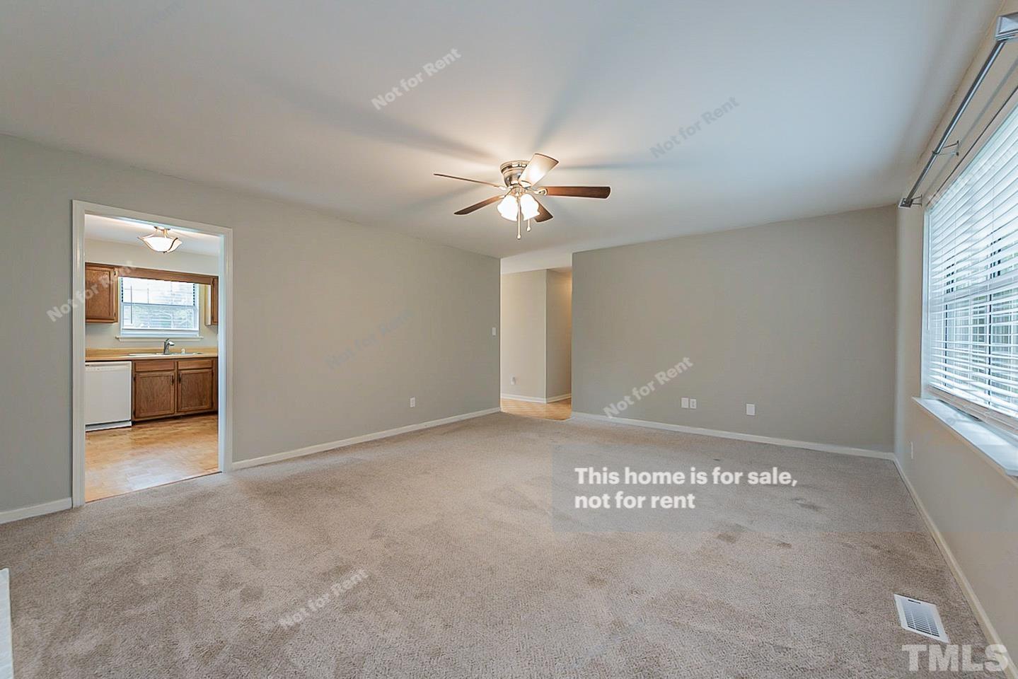917 Horton Road Durham, NC 27704 - Photo 9 of 17 an empty room with windows and ceiling fan