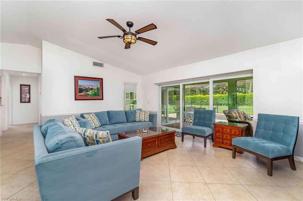 1933 Countess Court Naples, FL 34110 - Photo 4 of 25 a living room with furniture and a window