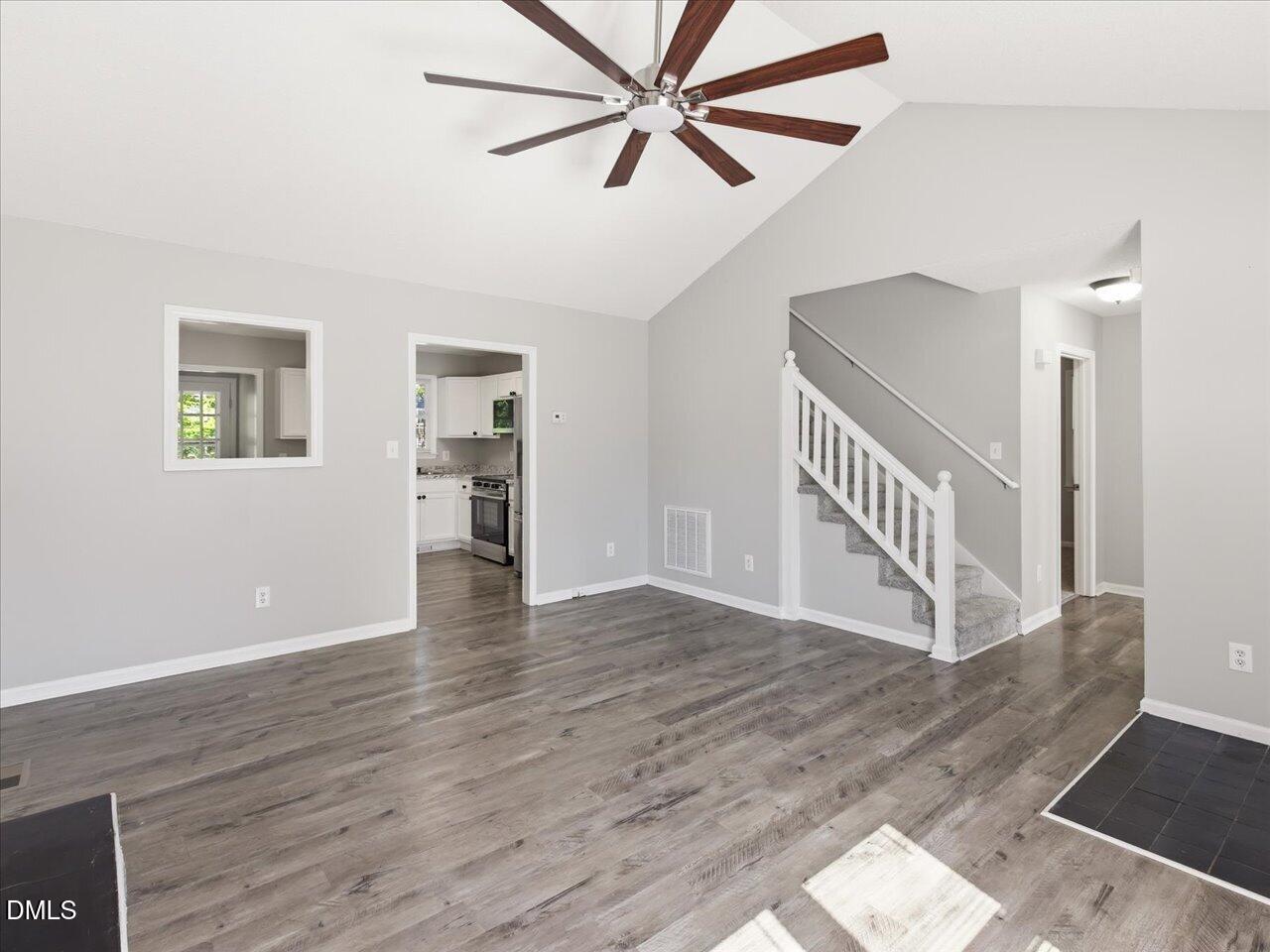 5 Jenee Lane Durham, NC 27703 - Photo 14 of 60 a view of an empty room with a window and wooden floor