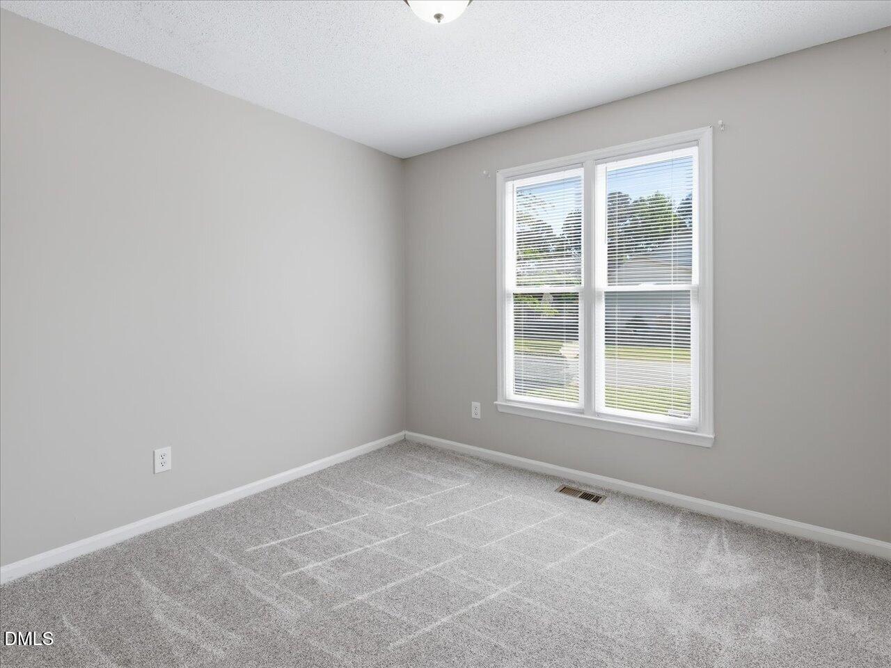 5 Jenee Lane Durham, NC 27703 - Photo 43 of 60 an empty room with a window