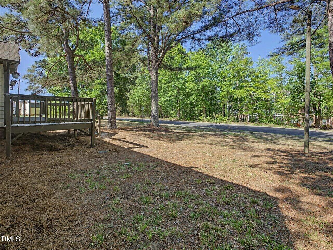 5 Jenee Lane Durham, NC 27703 - Photo 55 of 60 a view of a yard with wooden fence