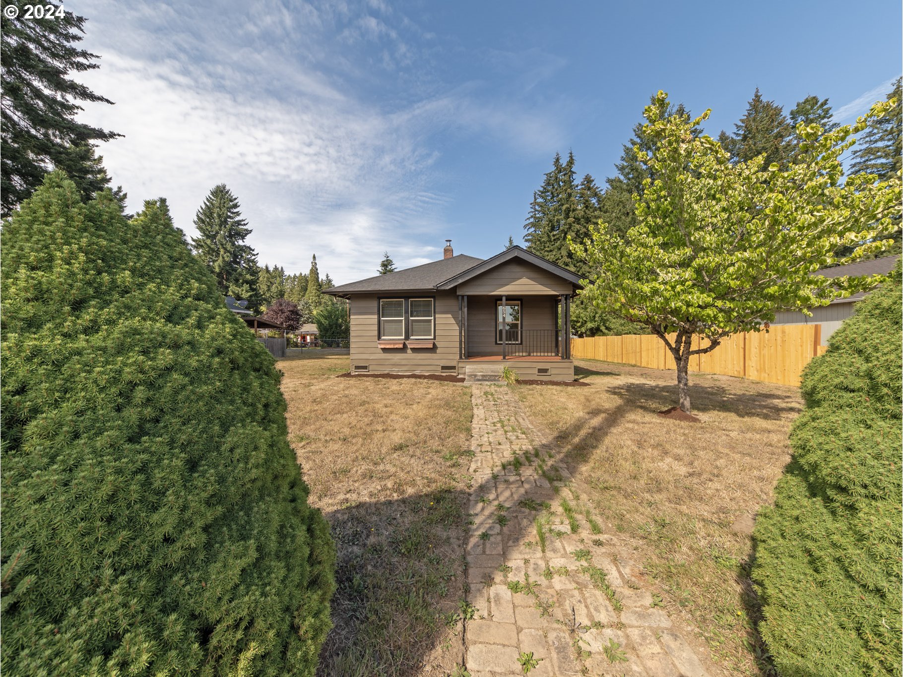 a backyard of a house with lots of green space