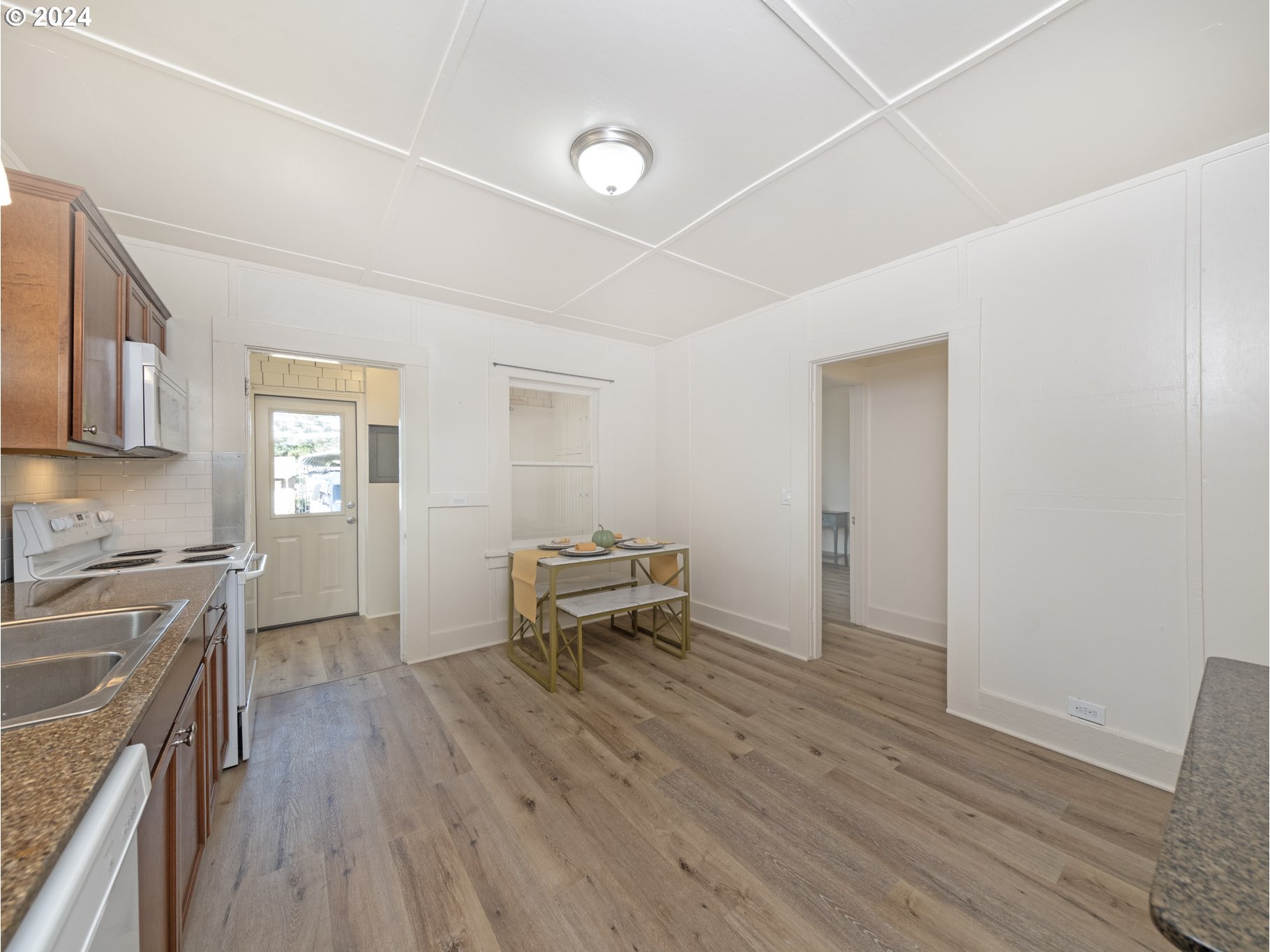 654 East Bridge Street Vernonia, OR 97064 - Photo 11 of 28 a living room with furniture and a wooden floor