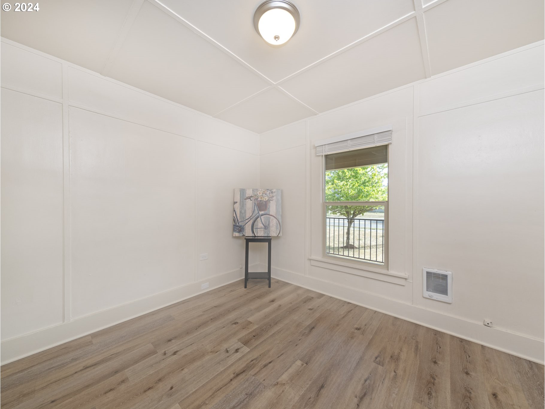 654 East Bridge Street Vernonia, OR 97064 - Photo 15 of 28 an empty room with wooden floor and windows