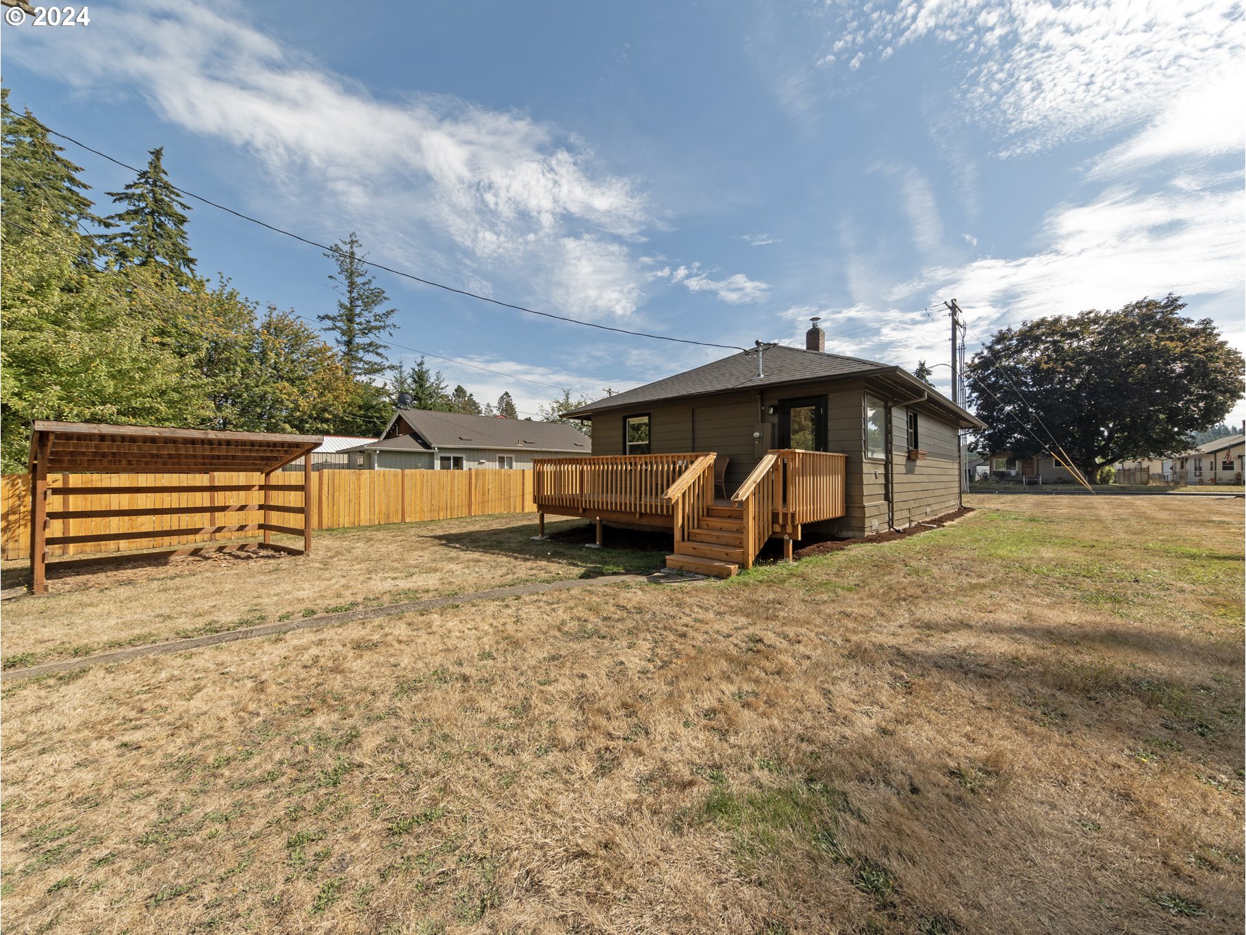 654 East Bridge Street Vernonia, OR 97064 - Photo 24 of 28 a view of a house with backyard and trees