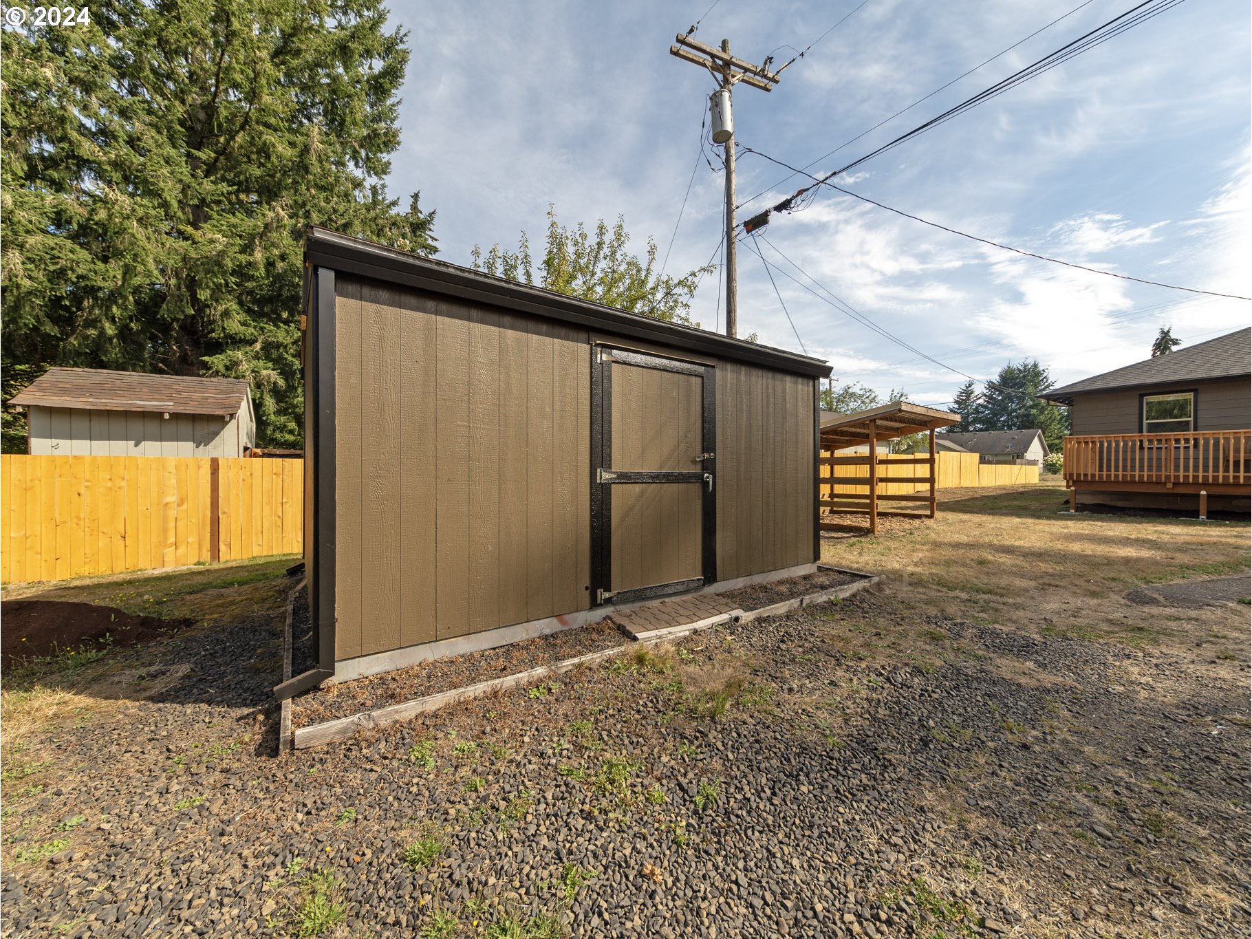 654 East Bridge Street Vernonia, OR 97064 - Photo 26 of 28 a view of a house with a backyard