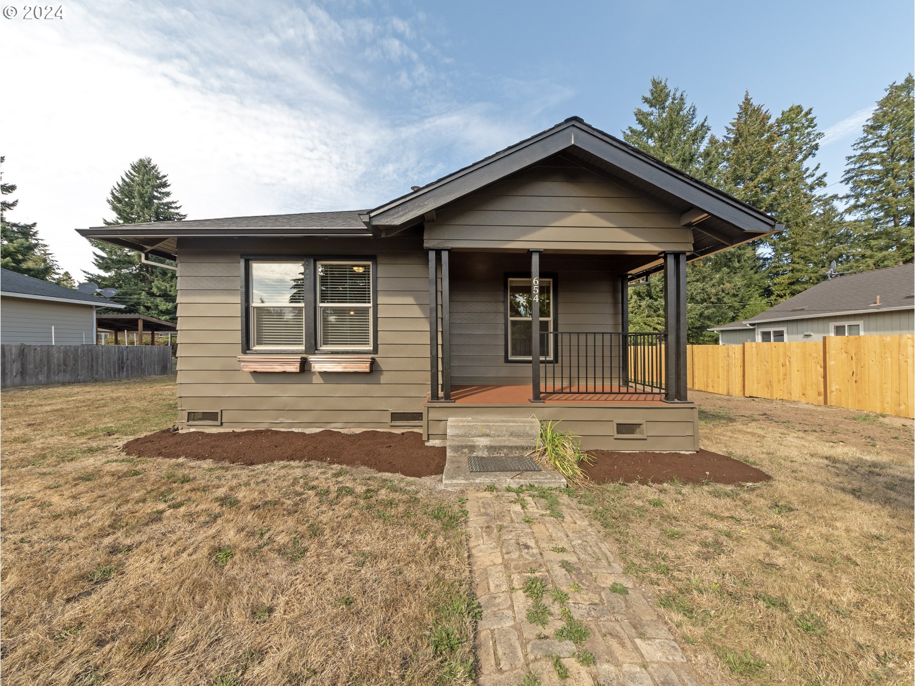 654 East Bridge Street Vernonia, OR 97064 - Photo 4 of 28 a view of a house with a yard