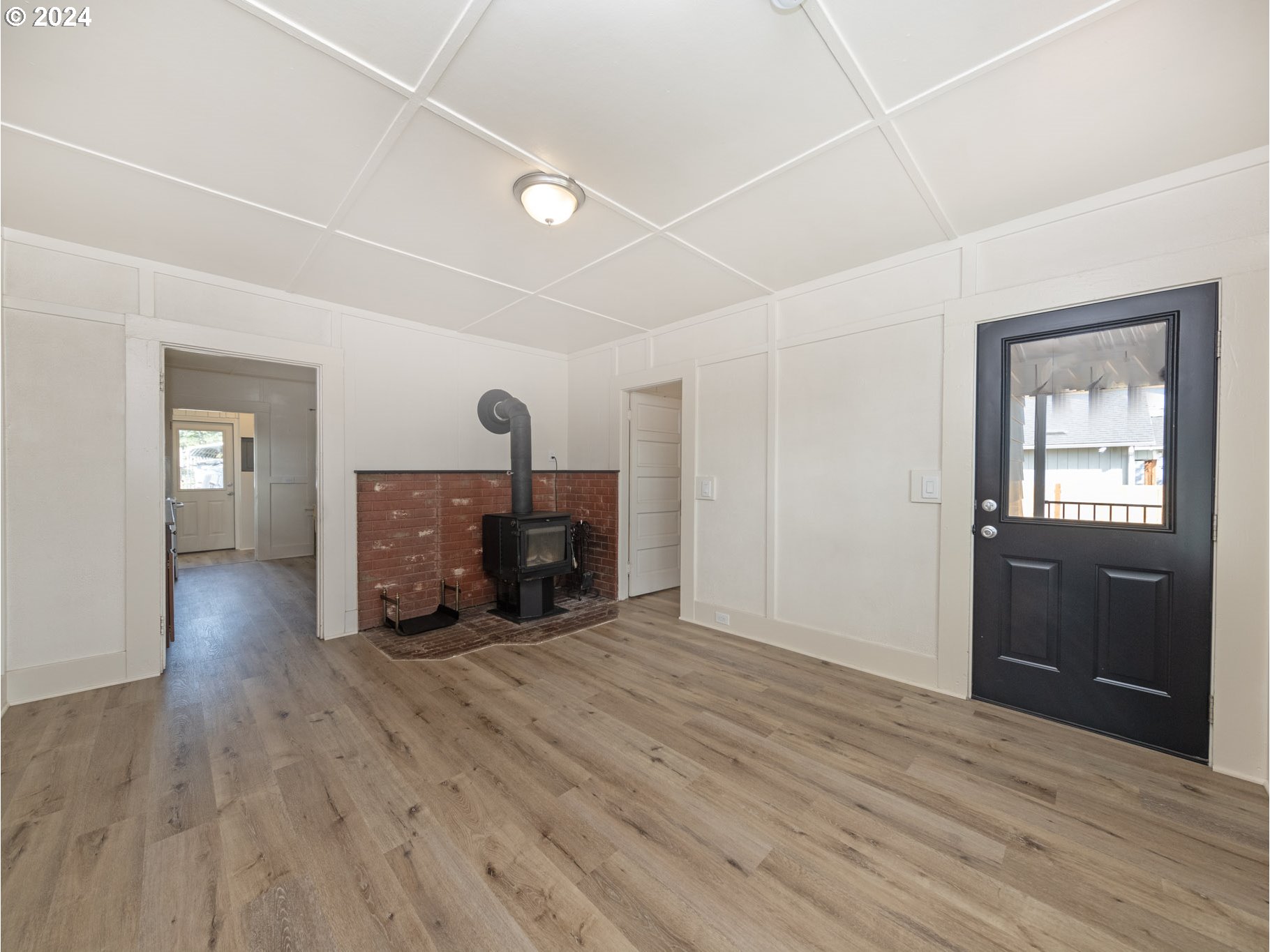 654 East Bridge Street Vernonia, OR 97064 - Photo 6 of 28 a view of a room with wooden floor lounge chair and windows