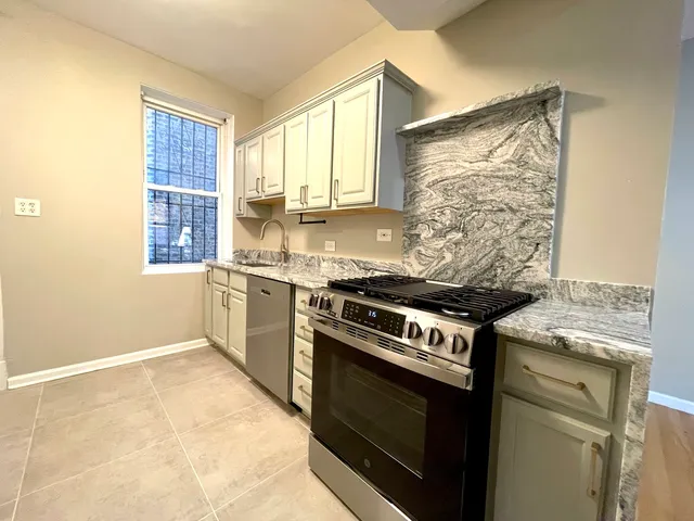 a kitchen with a stove and a sink
