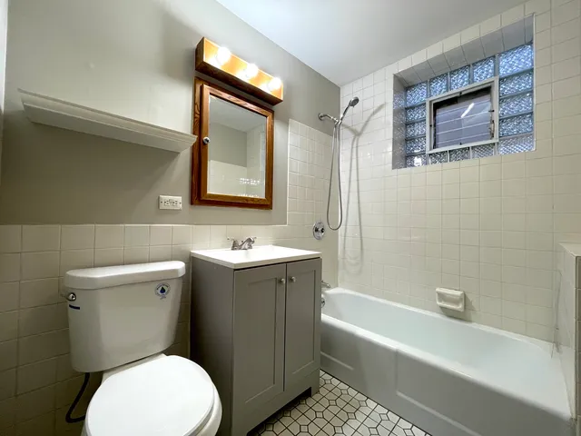 a bathroom with a toilet sink and bathtub