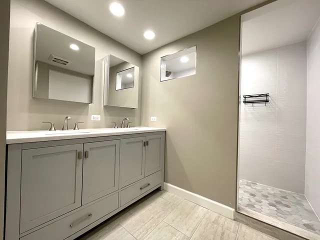a bathroom with a sink and mirror
