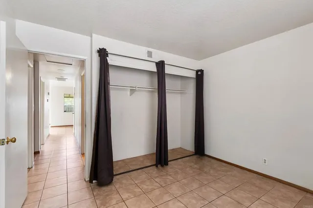 an aerial view of residential house and sandy dunes