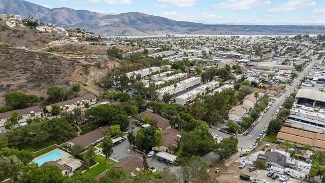 an aerial view of residential houses with outdoor space