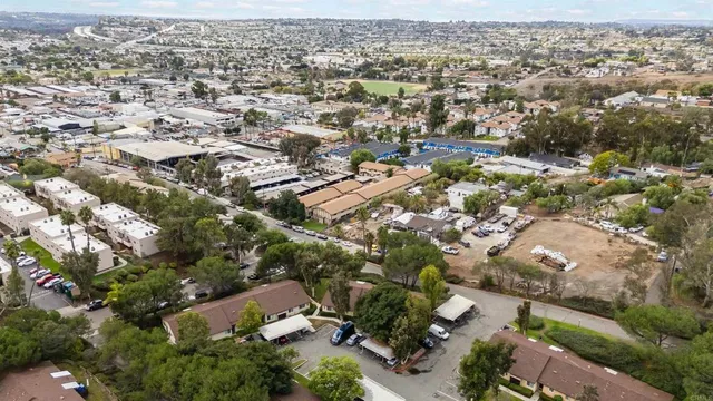 an aerial view of residential houses with outdoor space