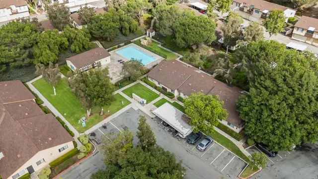 an aerial view of residential houses with outdoor space
