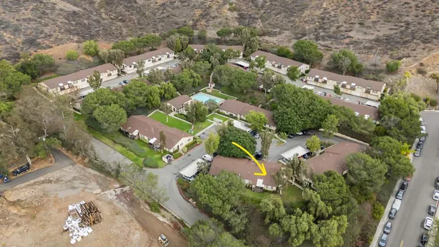 an aerial view of residential houses with outdoor space