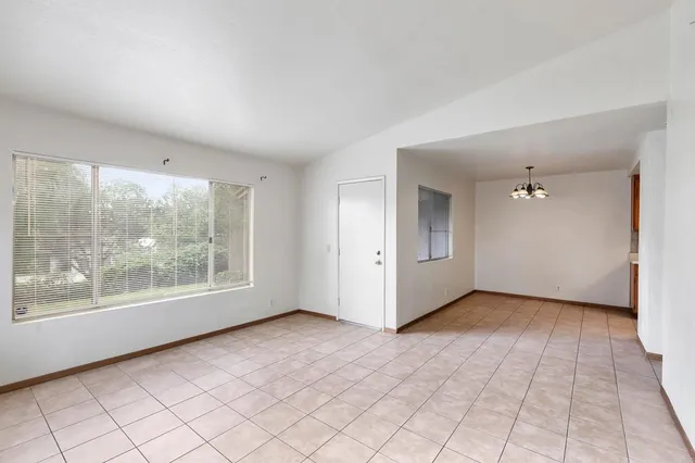 a kitchen with stainless steel appliances granite countertop a stove and a refrigerator