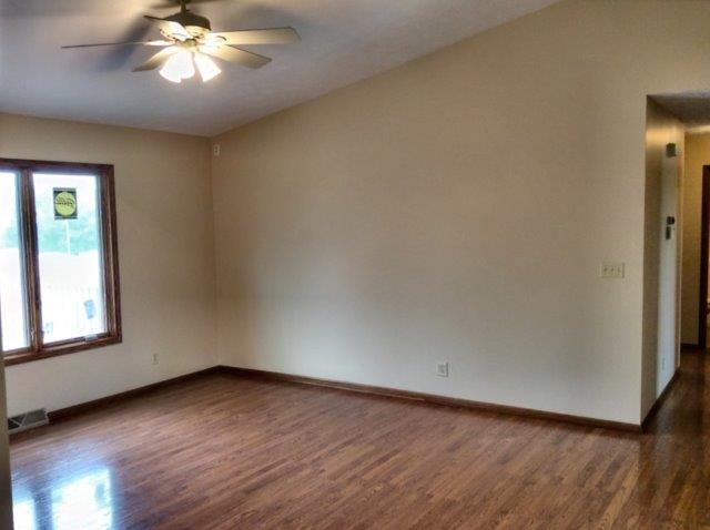 992 South Trainer Road Rockford, IL 61108 - Photo 13 of 15 wooden floor in an empty room with a window