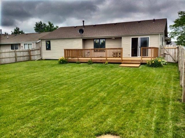 992 South Trainer Road Rockford, IL 61108 - Photo 14 of 15 a front view of a house with a yard table and chairs