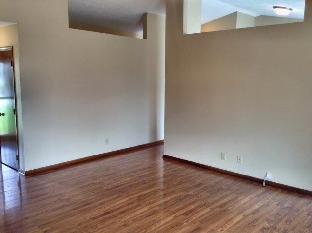 992 South Trainer Road Rockford, IL 61108 - Photo 3 of 15 a view of an empty room with wooden floor