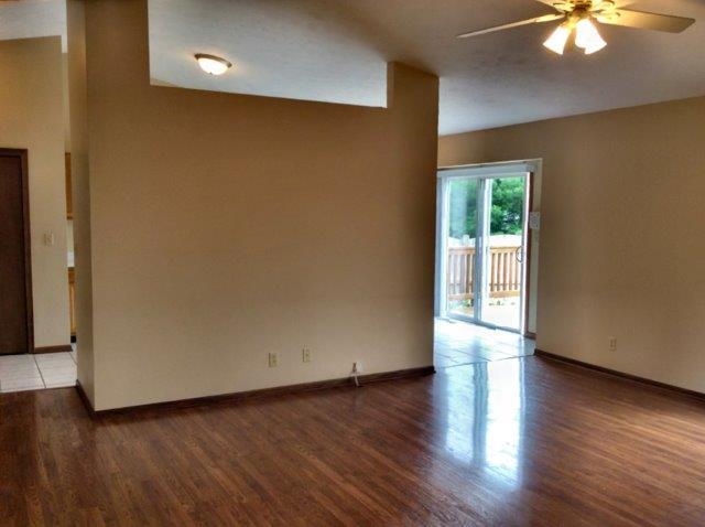 992 South Trainer Road Rockford, IL 61108 - Photo 4 of 15 an empty room with wooden floor and windows