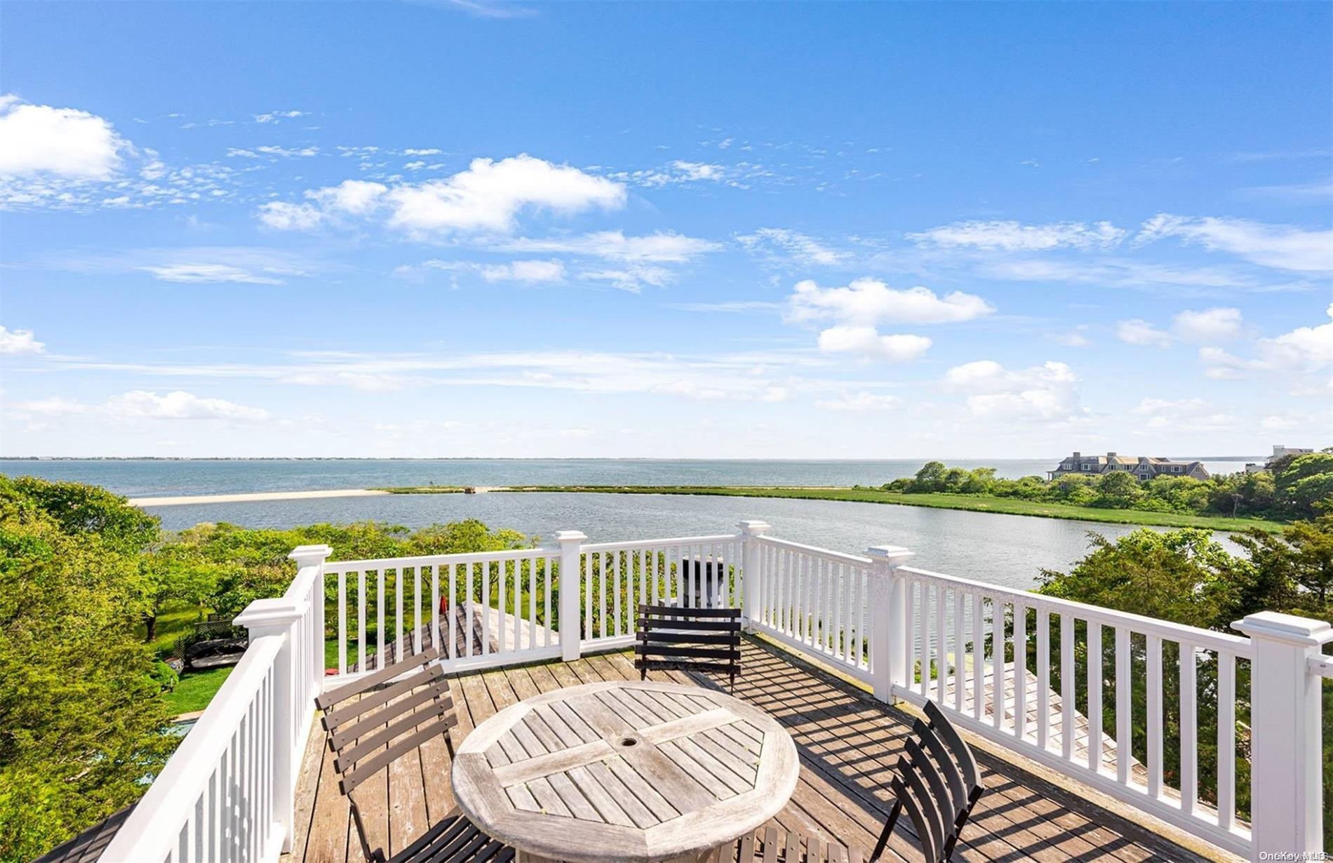 134 Middle Pond Road Southampton, NY 11968 - Photo 13 of 32 a view of a balcony with wooden floor and lake view