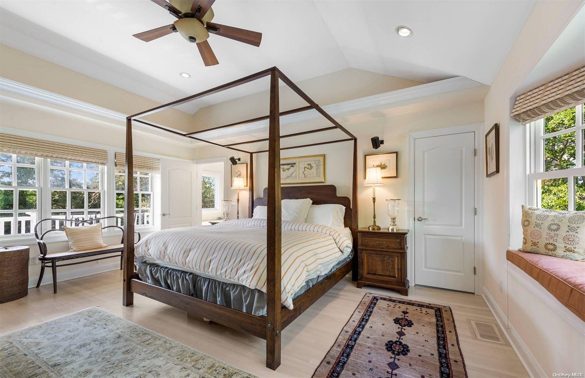 134 Middle Pond Road Southampton, NY 11968 - Photo 21 of 32 a bed room with a bed and a chandelier