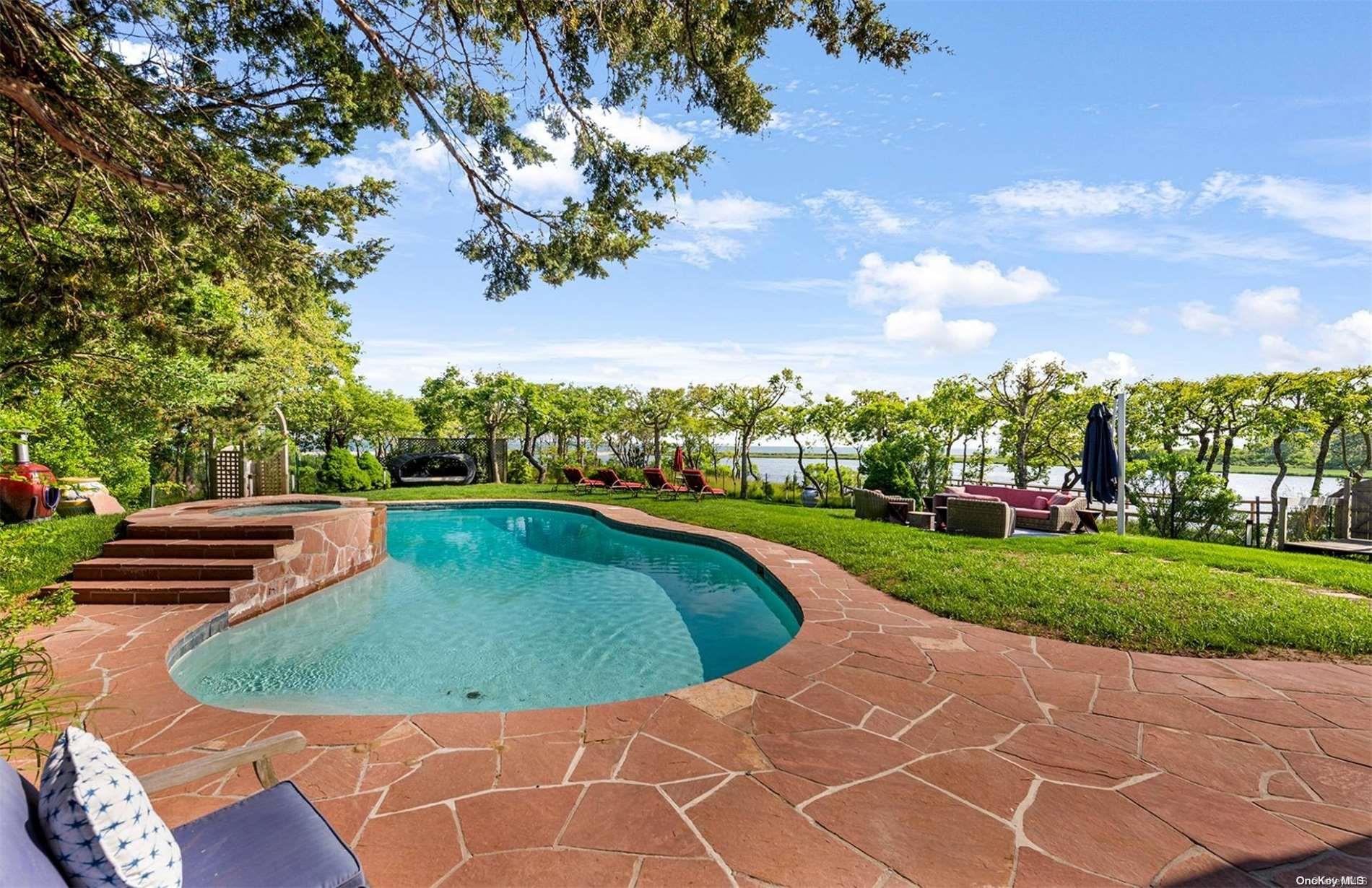134 Middle Pond Road Southampton, NY 11968 - Photo 27 of 32 a view of a swimming pool with a outdoor seating