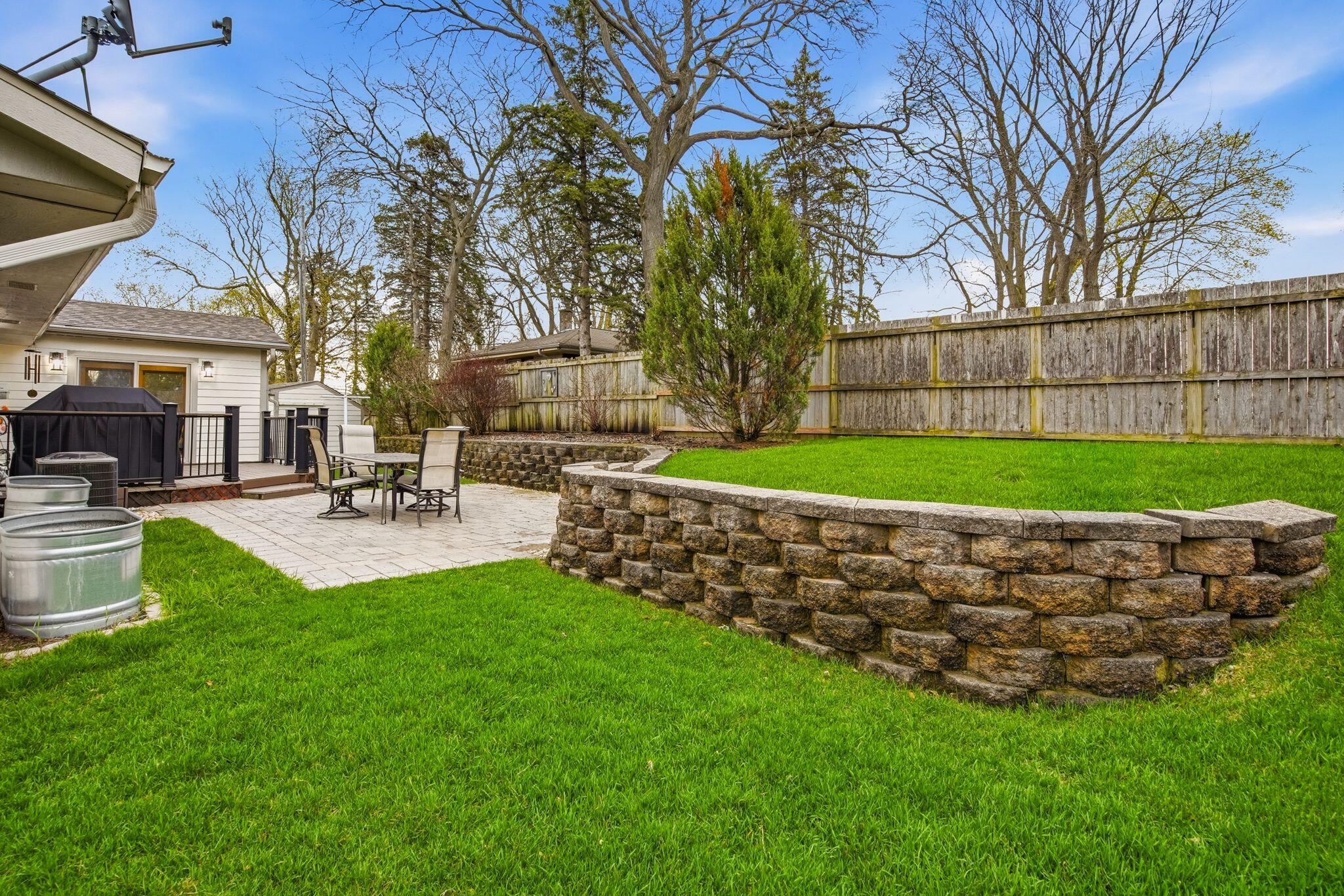 321 Lakeview Road South Milwaukee, WI 53172 - Photo 31 of 40 Backyard - Stamped Patio - Retaining Wall - Composite Deck
