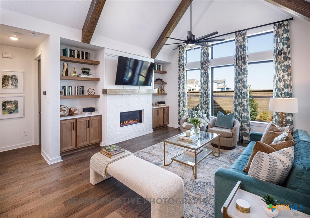 9212 Boathouse Drive Austin, TX 78744 - Photo 11 of 40 a living room with furniture large window and flat screen tv