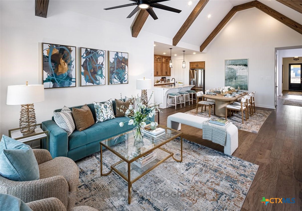 9212 Boathouse Drive Austin, TX 78744 - Photo 13 of 40 a living room with furniture and a rug