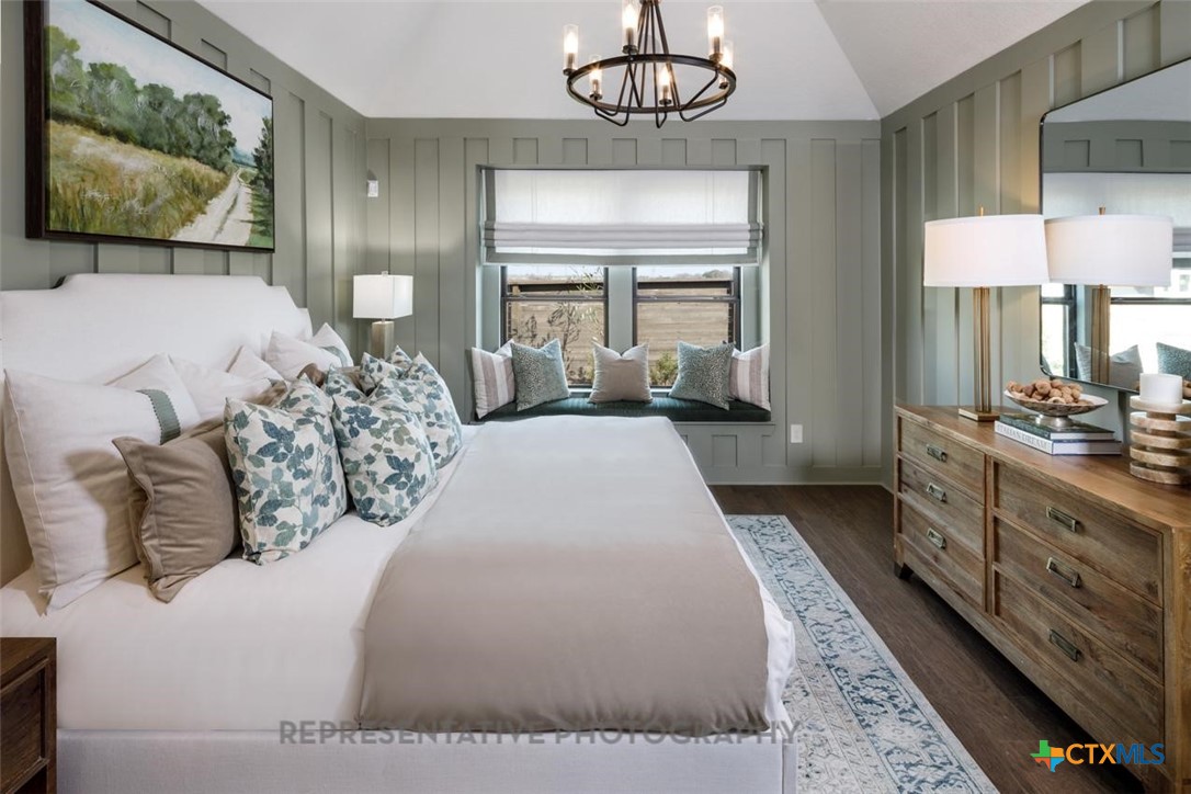 9212 Boathouse Drive Austin, TX 78744 - Photo 17 of 40 a spacious bedroom with a large bed and a flat screen tv