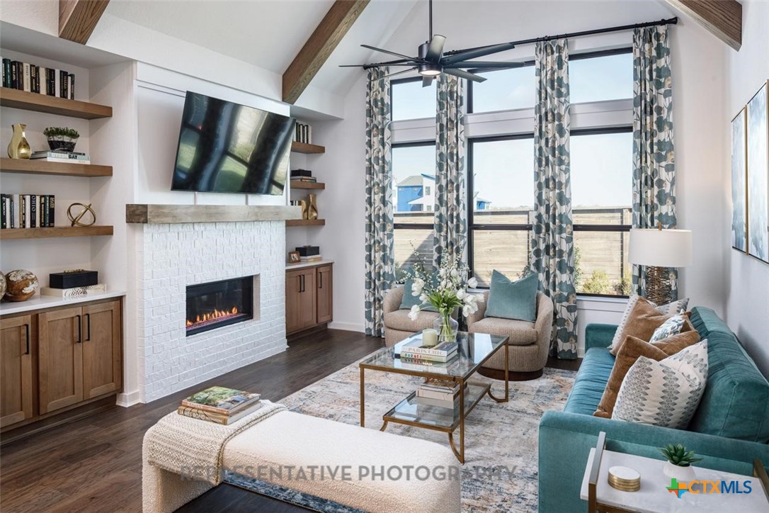 9212 Boathouse Drive Austin, TX 78744 - Photo 3 of 40 a living room with furniture and a fireplace