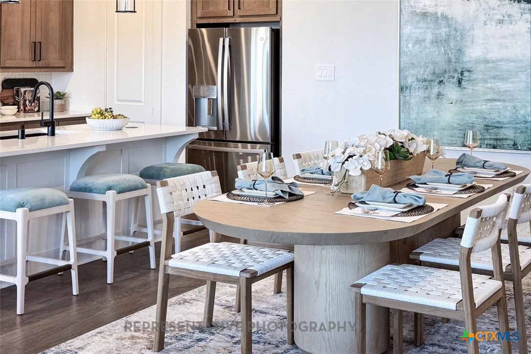 9212 Boathouse Drive Austin, TX 78744 - Photo 31 of 40 a view of a dining room with furniture